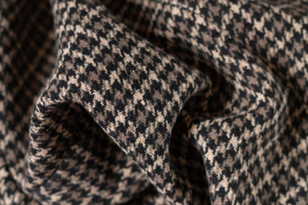 Brown warm wool fabric swatch houndstooth. Woven dogstooth check design background
