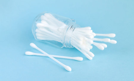 White cotton swabs or buds for personal hygiene in glass jar