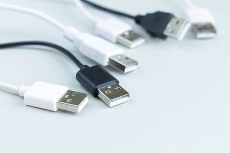 Different charging or data transmission plugs adapter from USB on gray backgroundの写真素材