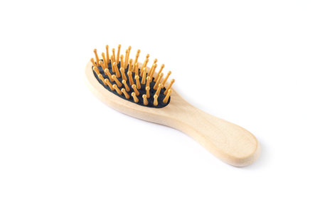 Single wooden massage hair brush isolated on white background