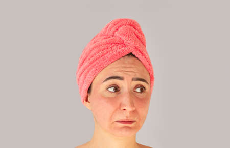 Portrait of beautiful happy woman applying cleansing foam for washing face. Skincare conceptの写真素材