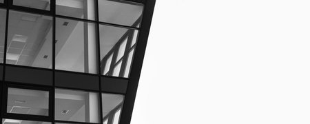 Fragment of glass and metal facade wall of modern commercial office building