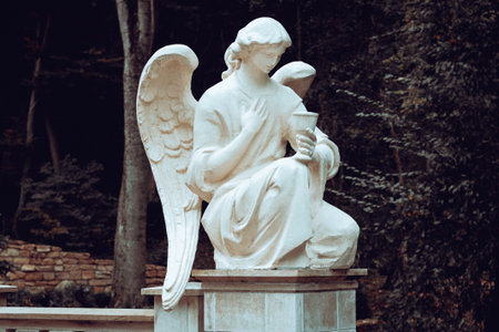 White stone guardian winged angel with goblet
