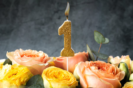 Gold glitter number 1 celebration candle with flowersの写真素材