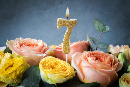 Gold glitter number 7 celebration candle with flowersの写真素材