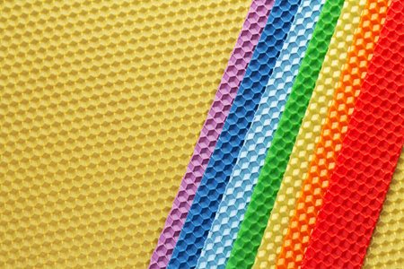 Set of colorful beeswax honeycomb from a bee hive for making handmade organic natural candlesの写真素材