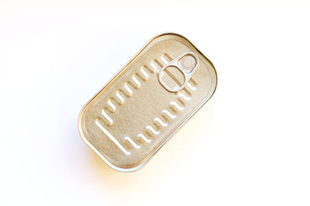 Single closed tin can with canned food isolated white backgroundの写真素材