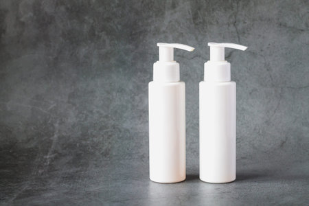 Pump or dispenser bottles for cream, lotion, shampoo and other cosmetic products. Mock-up for your brand templateの写真素材
