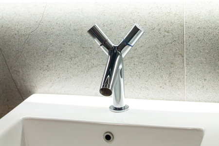 Trendy modern chrome metal faucet and bathroom sink