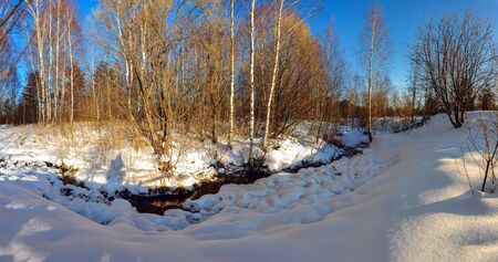 Winter Creek in the snow and treesの写真素材