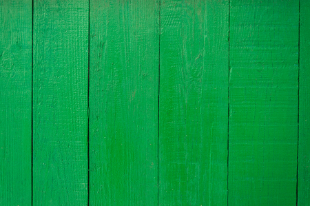 Wooden fence painted in green, texture.の写真素材