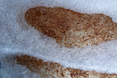 Texture of rusty sheet steel covered with snowの写真素材