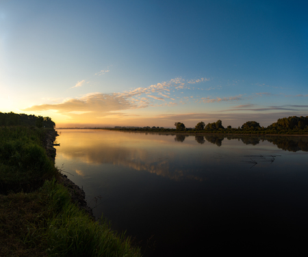 Sunrise over the river on a summer morningの素材 [FY310110790477]