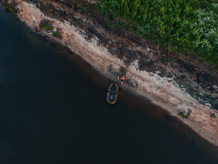 View of the boat by the river from the height of the quadrocopterの写真素材