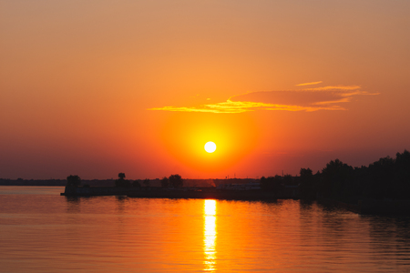 Sunset over the waterの写真素材