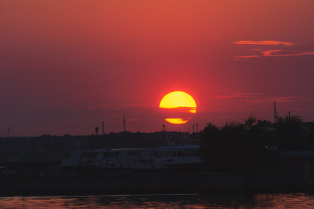 Sunset over the waterの写真素材