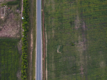 asphalt road in the field from a heightの写真素材