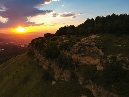 Sunset over Kislovodsk from the height of the throne near the mountainの写真素材
