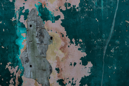 texture of old and peeling green paint on concrete wallの写真素材