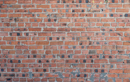 The texture of the old brickwork of red brickの写真素材