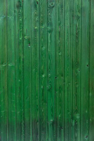 Wooden texture with old peeling paint greenの写真素材