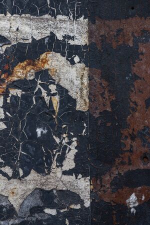 Macro texture of peeled white black paint on the gland close-up.の写真素材