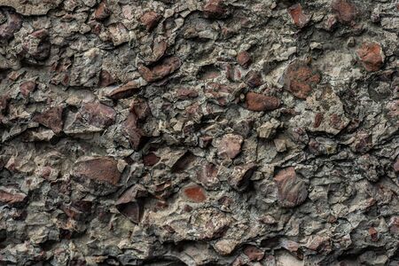 Texture of concrete wall and foundation close-up with small pebbles and chippedの写真素材