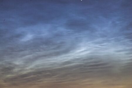Noctilucent clouds closeup summer night. Rare atmospheric phenomenonの写真素材
