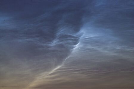 Noctilucent clouds closeup summer night. Rare atmospheric phenomenonの写真素材