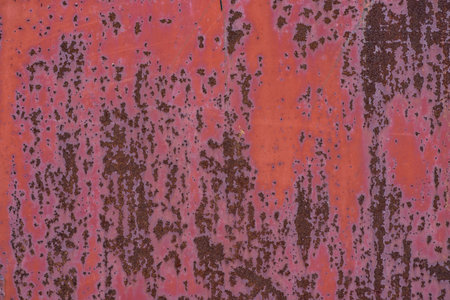 Rusty iron sheet with falling off paint