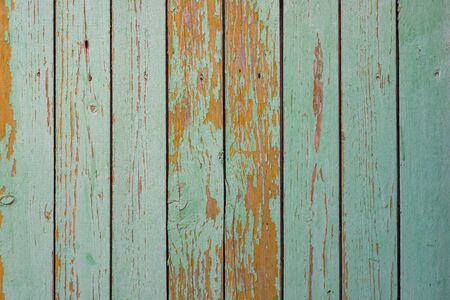 Wall texture of wooden boards with peeling green paintの写真素材