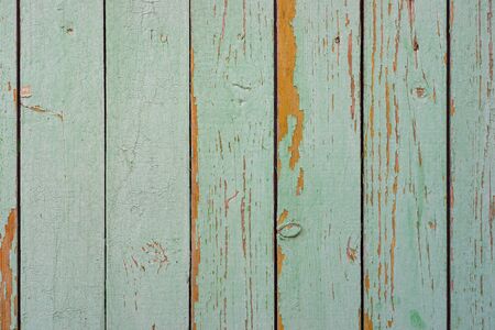 Wall texture of wooden boards with peeling green paintの写真素材