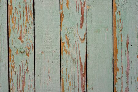 Wall texture of wooden boards with peeling green paintの写真素材