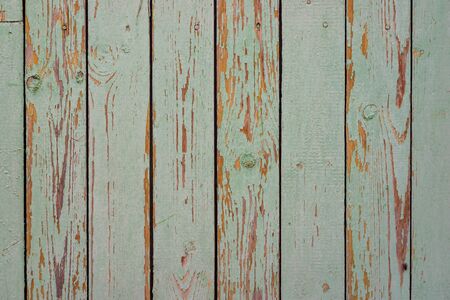 Wall texture of wooden boards with peeling green paintの写真素材