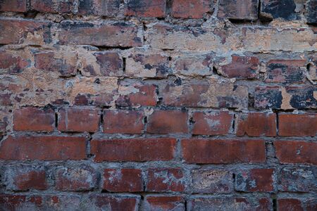 Texture of old brickwork with peeling color paintの写真素材