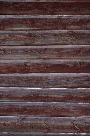 The texture of the old wall of wooden boards painted in Burgundyの写真素材
