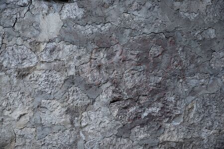 Texture of stone wall made of grey stonesの写真素材