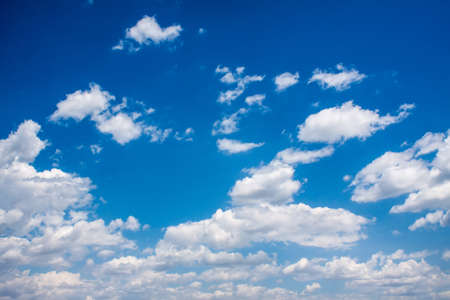 Bright clouds in the blue summer skyの写真素材