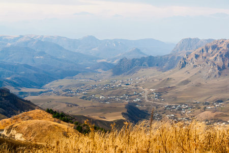 Caucasus mountains hazy in the gloomy autumn weatherの写真素材