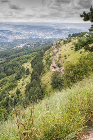 Cloudy weather in the mountains of the Northern Caucasus in the town of Kislovodsk. The view from the mountain.の写真素材