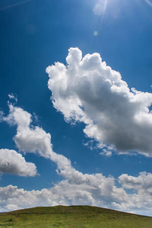 Clouds on the blue sky in a mountainous areaの写真素材