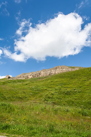 Clouds on the blue sky in a mountainous areaの写真素材