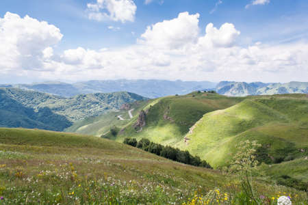Clouds on the blue sky in a mountainous areaの写真素材