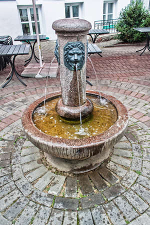 A small fountain in a city courtyard in Minsk the capital of Belarusの写真素材