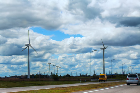 Wind turbines standing along the road in the countryside of Belarusの写真素材