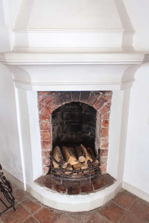 Old fireplace covered with soot from the wood prepared for ignitionの写真素材