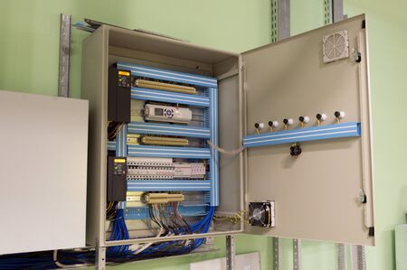 Opened ventilation system control box on the wall of the industrial ventilation roomの写真素材