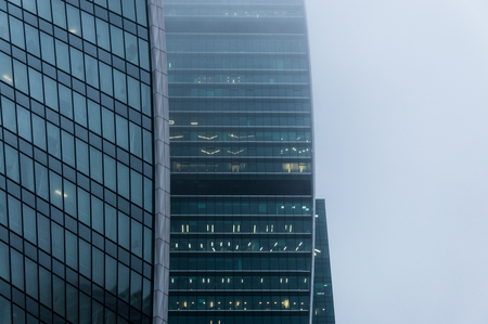 Close-up view of the modern skyscraper in the mistの写真素材