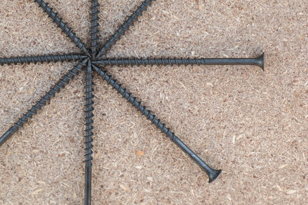 Background with copy space on the hobby, DIY, hand tools, house repairing theme. Screws on the flake...