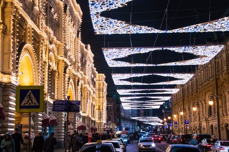 MOSCOW, RUSSIAN FEDERATION - DECEMBER 27, 2017 Side view of the street and GUM exterior decorated with christmas lights. New Year and Christmas holidays in Russia.のeditorial素材